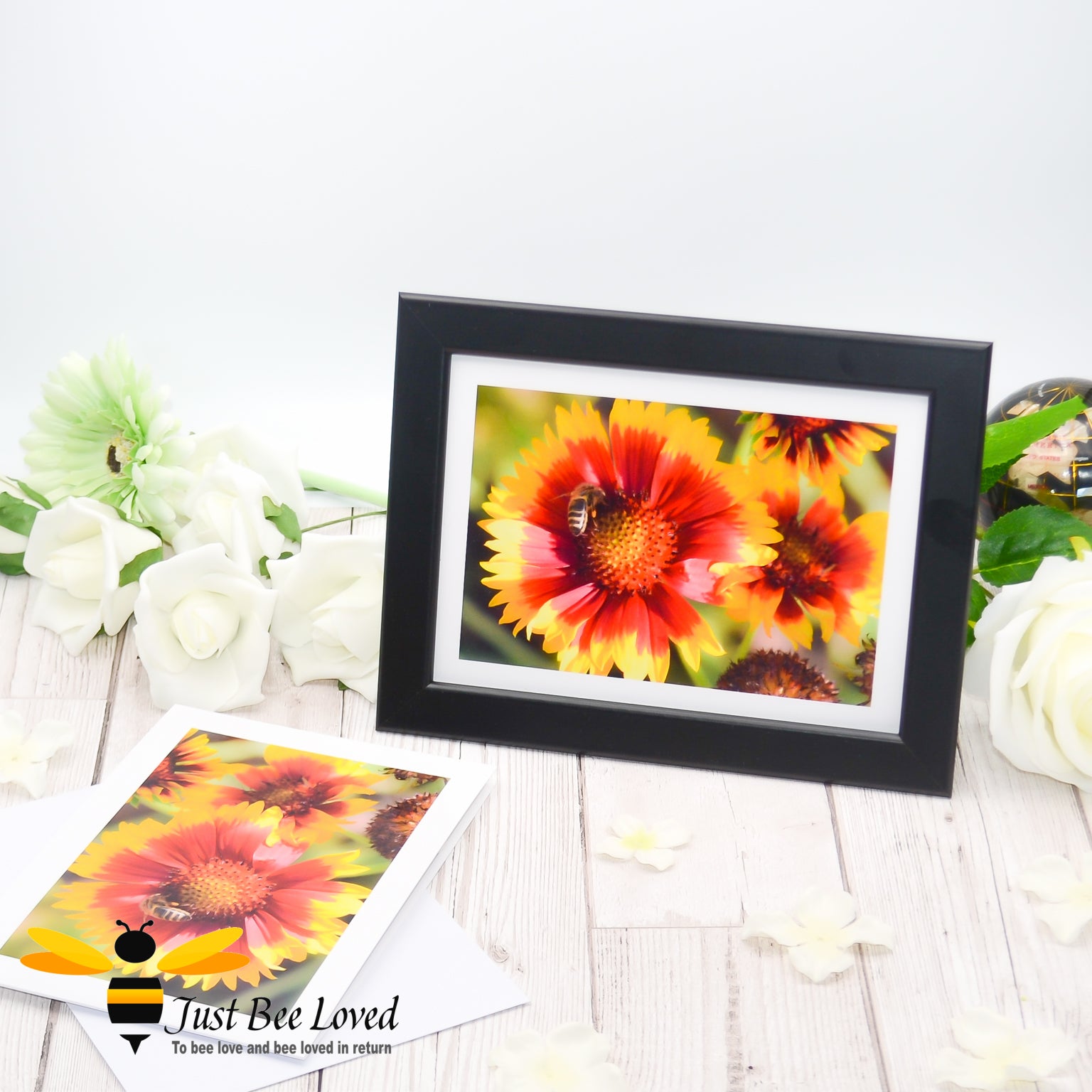a framed photographic greeting card featuring an image of a honey bee collecting pollen from orange flowers.