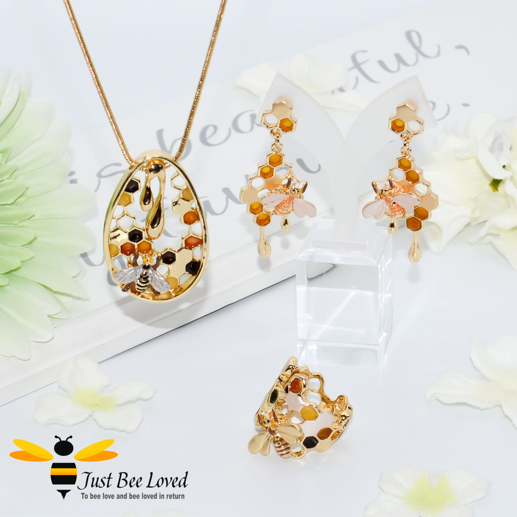 gold plated 3 piece jewellery set featuring golden honey drips, enamelled filled honeycomb to look like pollen with a honeybee.  