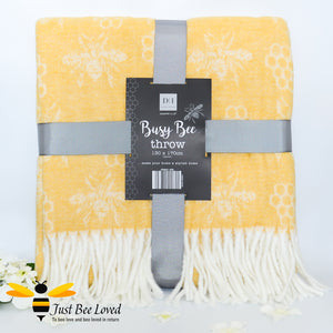 acrylic woollen throw blanket in pastel yellow featuring an all over honey bee & honeycomb design with fringe border