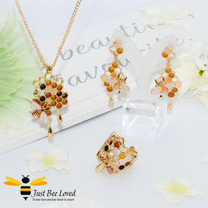 gold plated 3 piece jewellery set featuring golden honey drips, enamelled filled honeycomb to look like pollen with a honeybee.  