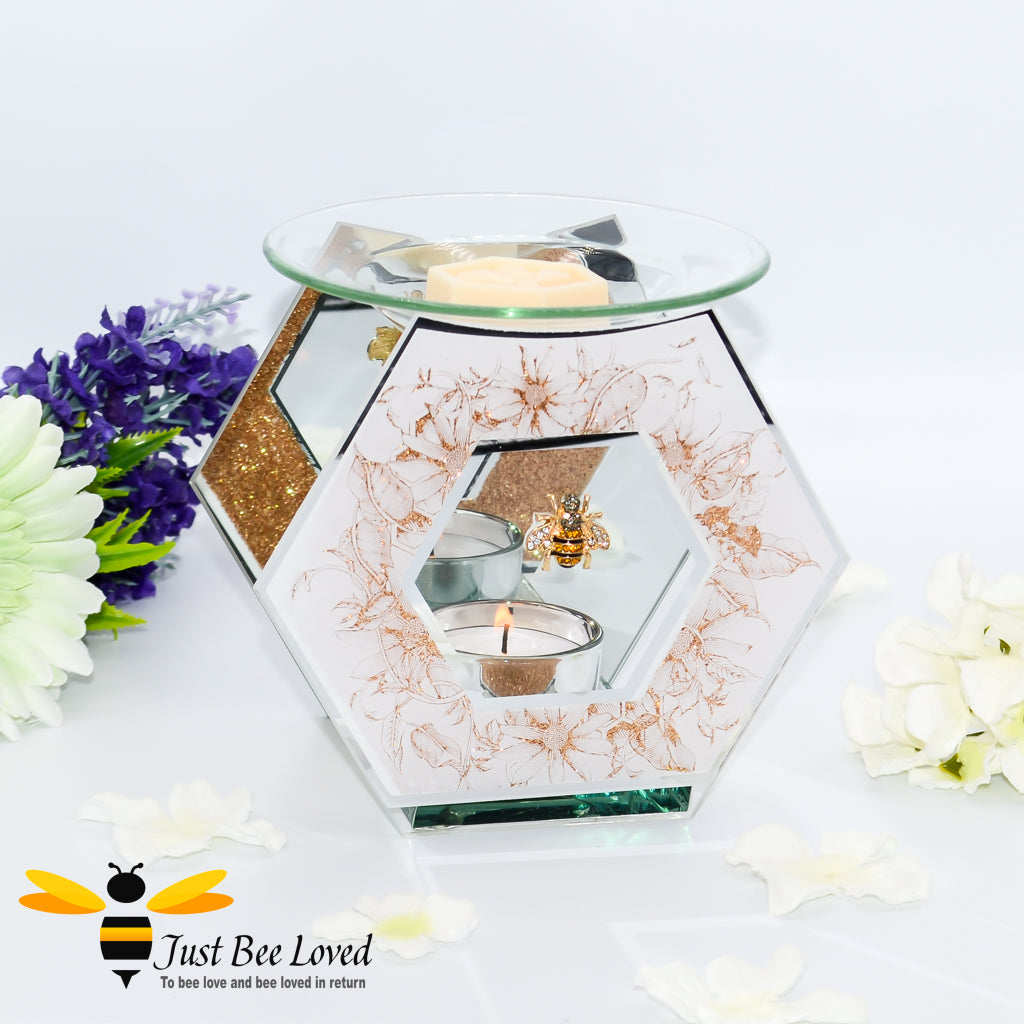 hexagon glass mirrored wax melt & oil burner featuring a shimmering golden design of honeycomb and flowers with rhinestone bee embellishment. 
