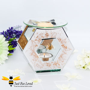 hexagon glass mirrored wax melt & oil burner featuring a shimmering golden design of honeycomb and flowers with rhinestone bee embellishment. 