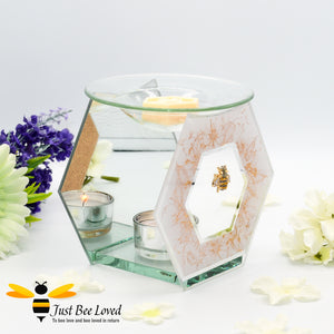 hexagon glass mirrored wax melt & oil burner featuring a shimmering golden design of honeycomb and flowers with rhinestone bee embellishment. 