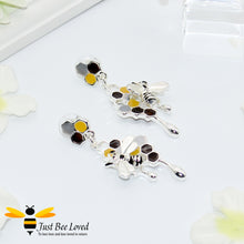 Load image into Gallery viewer, silver plated earrings each featuring honey drips, enamelled filled honeycomb to look like pollen with a honeybee.  
