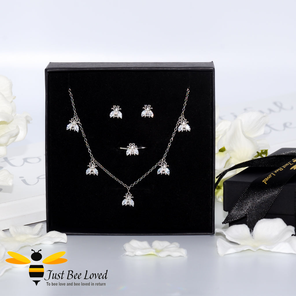 sterling silver jewellery set featuring a necklace detailed with 5 white crystal bees, matching bee stud earrings and ring.
