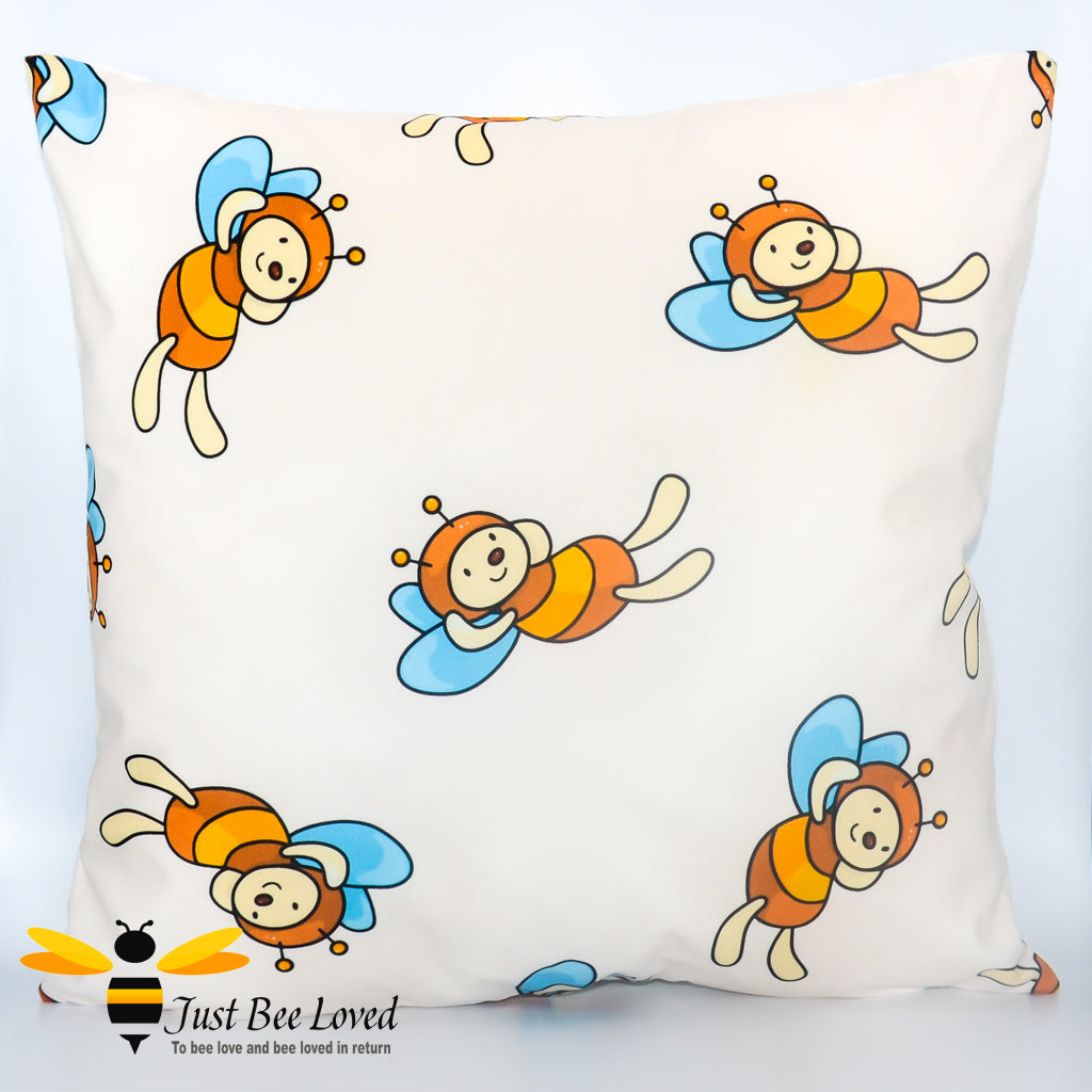 Children's decorative bee scatter cushion in cream featuring cartoon bumblebees