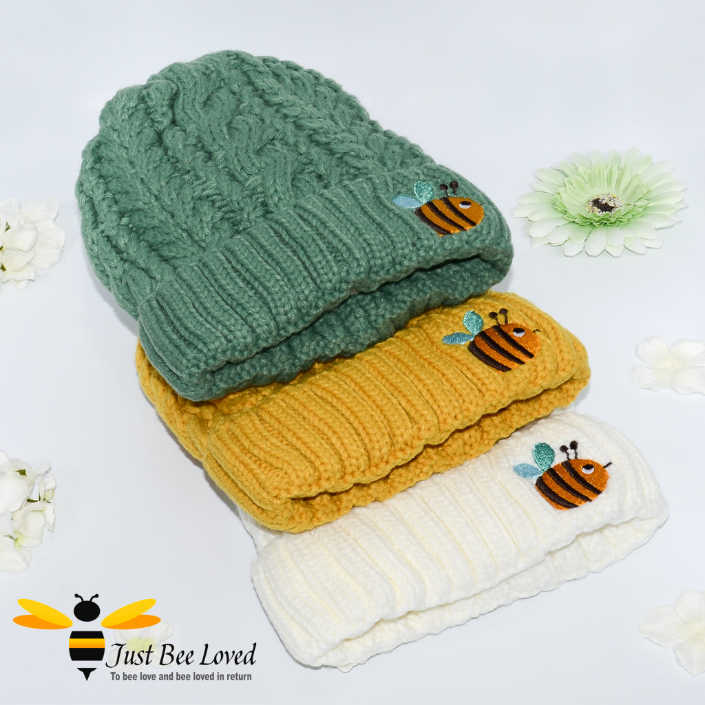 Aran style knitted hats with embroidery bee in green, mustard and cream.