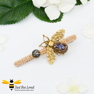Large gold colour metal hair clip with purple jewelled bee decoration