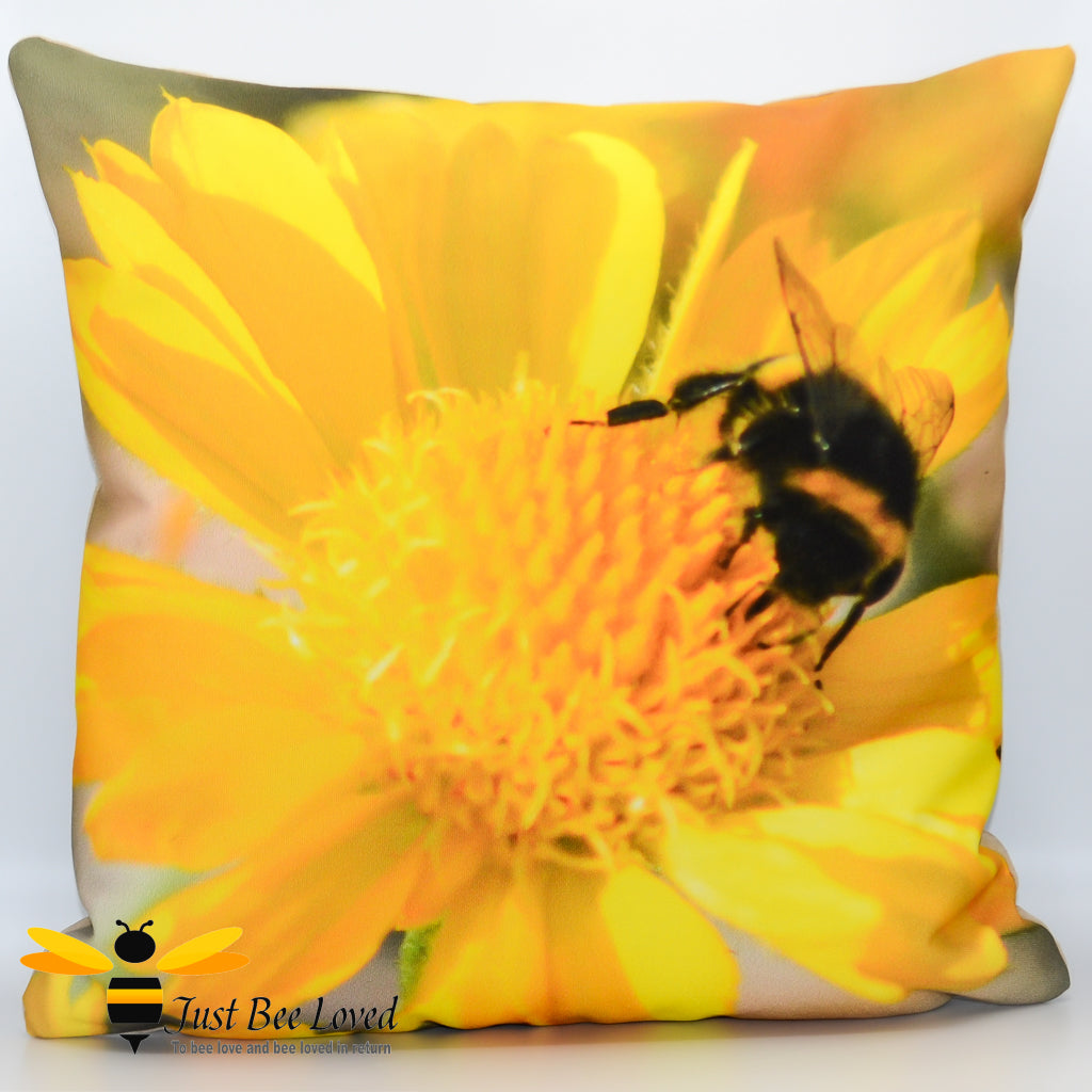 A cushion featuring a photographic image of a bumblebee foraging on a bright yellow flower.