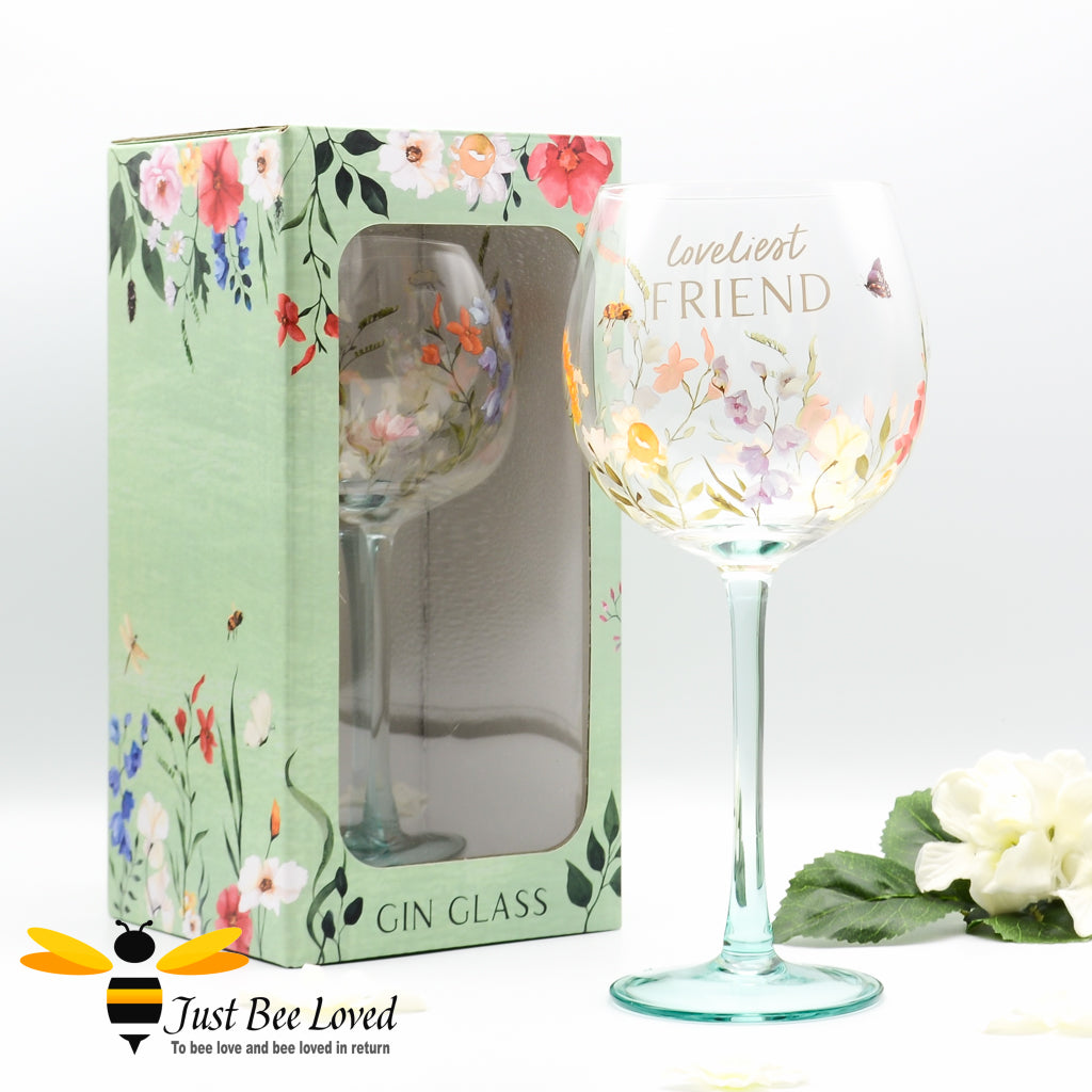 A gift boxed stemmed gin glass with bees, butterfly and floral design with 'Loveliest FRIEND' text.