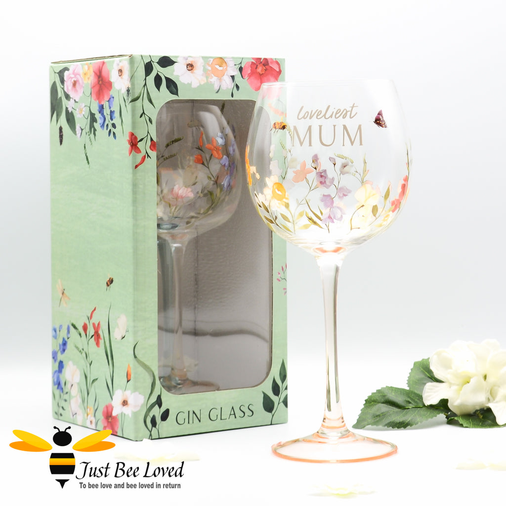 A gift boxed stemmed gin glass with bees, butterfly and floral design with 'Loveliest MUM' text.