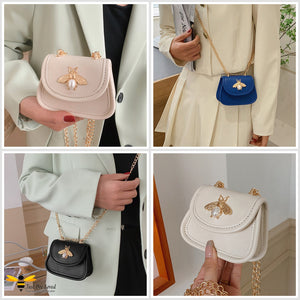 Gallery of lady holding small mini purse bag with bee decoration