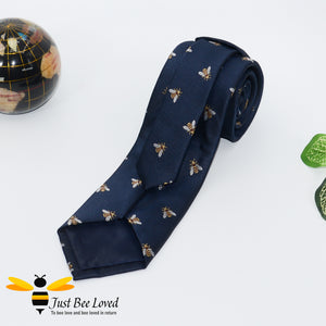 Handmade woven navy blue necktie featuring an all over embroidery design of bumblebees