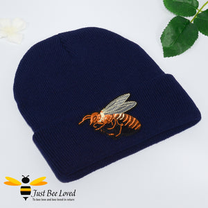 Navy blue ribbed knit beanie skull caps featuring a large front embroidered bee motif.