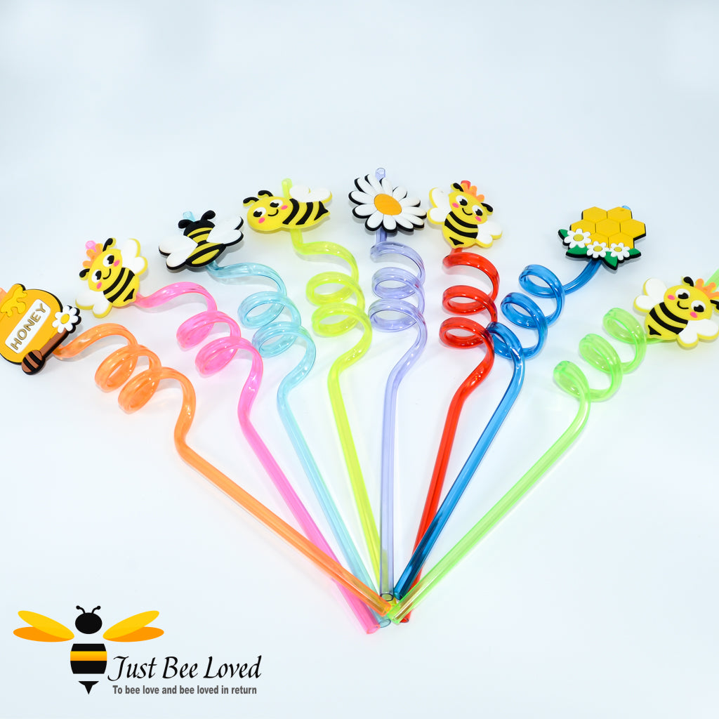 A collection of spiral drinking straws with colourful bee-themed attachments at the end.