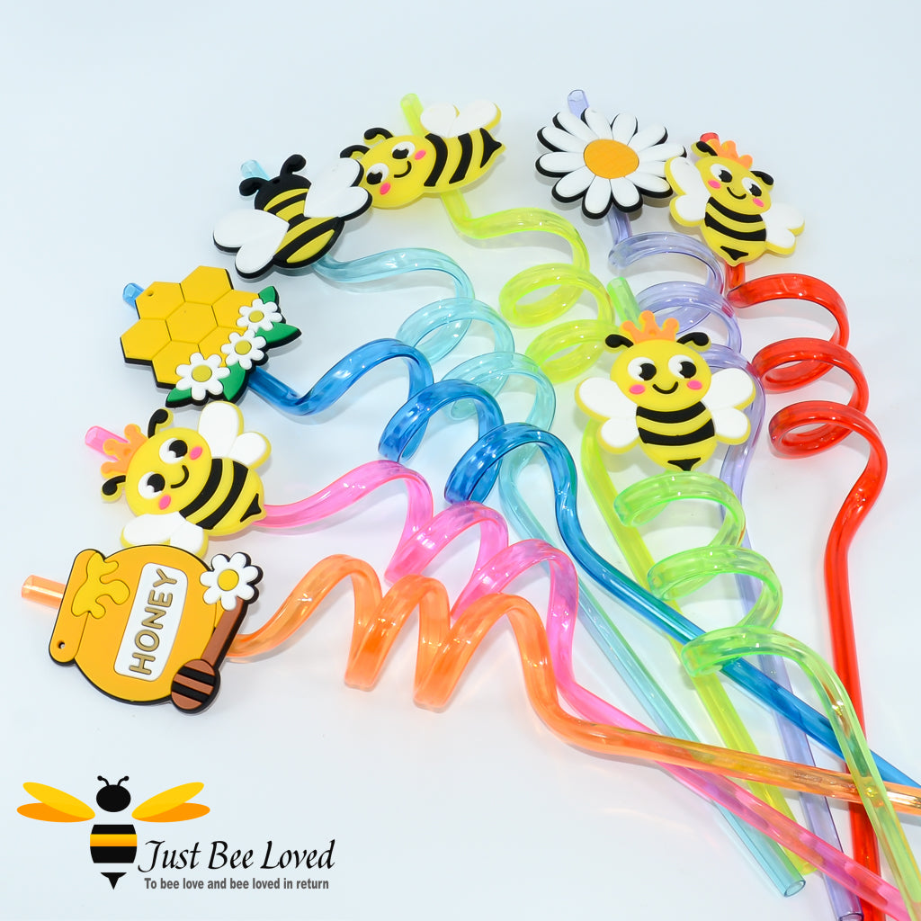 A collection of spiral drinking straws with colourful bee-themed attachments at the end.