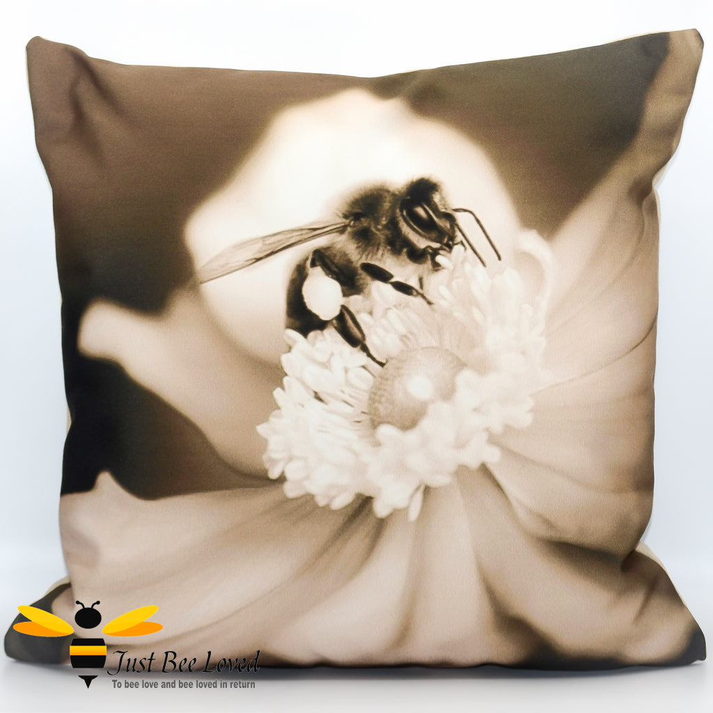 A photographic scatter cushion featuring a sepia-toned image of a honey bee foraging on a white flower.