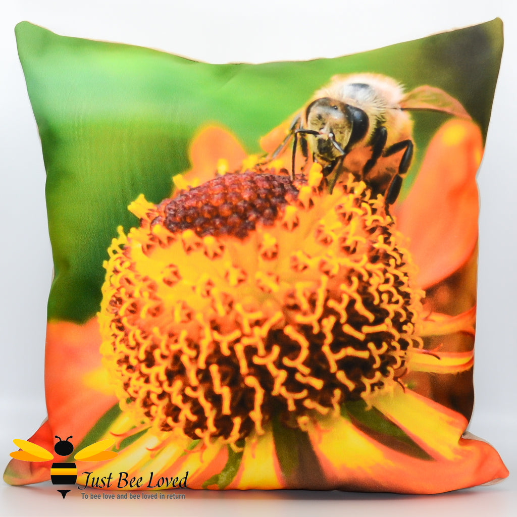 A photographic cushion featuring an image of a bee foraging on a helenium flower, with a vibrant green background. 