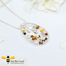 Load image into Gallery viewer, silver plated pendant necklaces each featuring golden honey drips, enamelled filled honeycomb to look like pollen with a honeybee.  