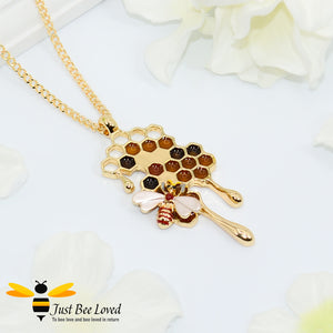 gold plated pendant necklaces each featuring golden honey drips, enamelled filled honeycomb to look like pollen with a honeybee.  