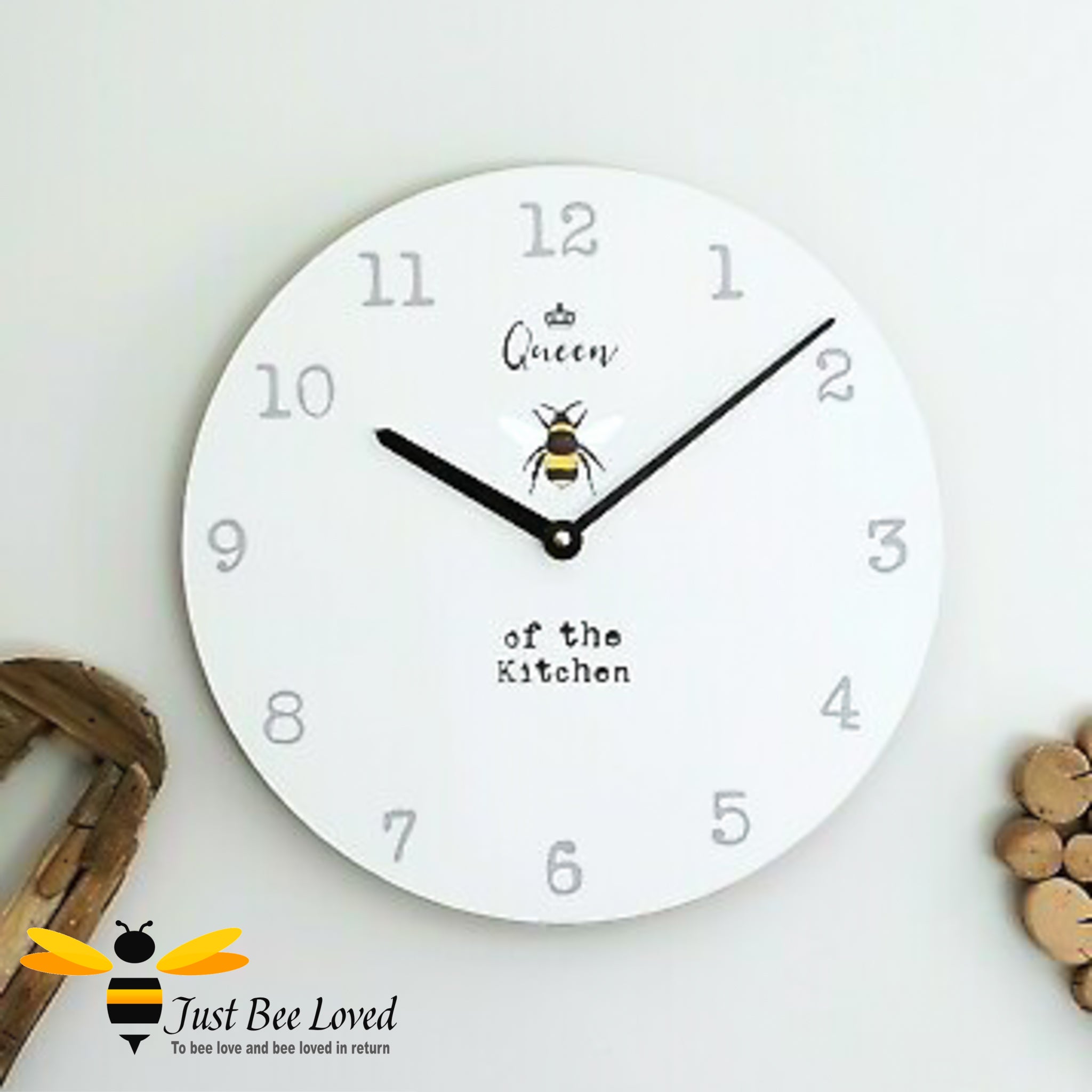 Large wooden wall clock with bumblebee and crown with text "queen bee of the kitchen".