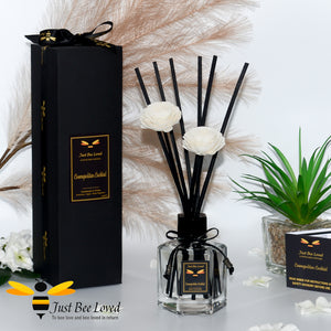 Luxury hexagon shaped black rattan vegan reed diffuser with flower reeds.. Fragrance cosmopolitan cocktail