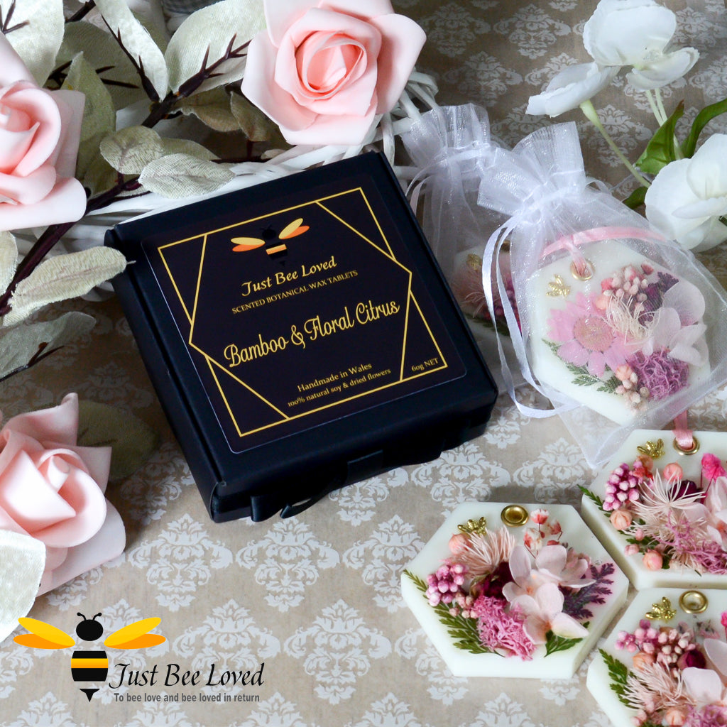 Gift box set of Hexagon shaped scented botanical wax tablets decorated with pink florals and gold bee embellishment.