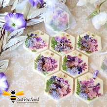 Load image into Gallery viewer, display of scented botanical vegan wax tablets decorated with purple natural flowers, gold bee, fragrance amber &amp; spiced plum