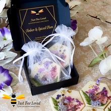 Load image into Gallery viewer, Luxury gift box of scented botanical vegan wax tablets decorated with purple natural flowers, gold bee, fragrance amber &amp; spiced plum