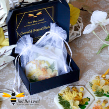 Load image into Gallery viewer, Gift box of Luxury scented botanical vegan wax tablets decorated with yellow natural flowers, gold bee, fragrance coconut &amp; tropical fruits