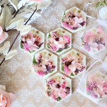 Load image into Gallery viewer, Hexagon shaped scented botanical wax tablets decorated with pink florals, gold bee embellishment perfumed with essential oils