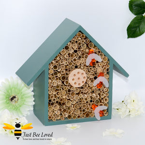 Wooden tubed solar lights bee and insect hotel in yellow and green