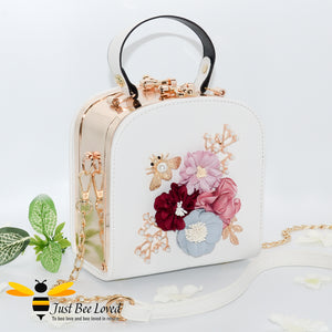 hand-crafted 3D embellished square metal handbag featuring a bouquet of flowers, golden leaves with a pearlised bee in white