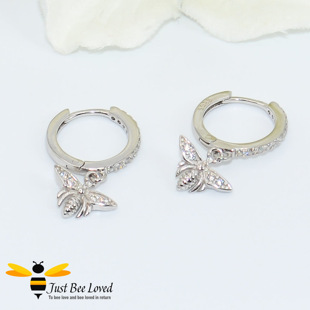 sterling silver hoop earrings inlaid with white cubic zirconia crystals with a bee pendant