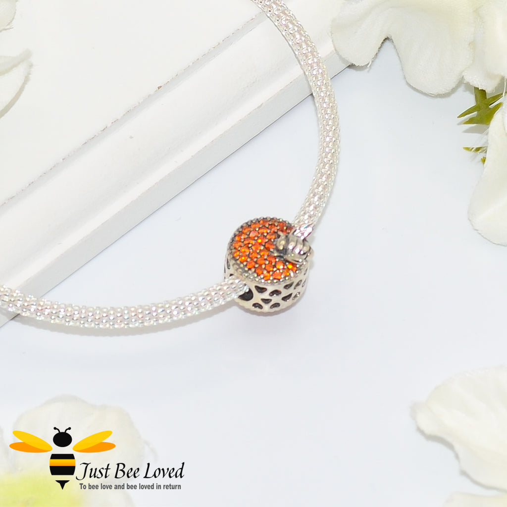 sterling silver charm detailing amber crystals with silver bees and hearts.