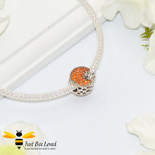 Load image into Gallery viewer, sterling silver charm detailing orange crystals with silver bees either side surrounded by love hearts.