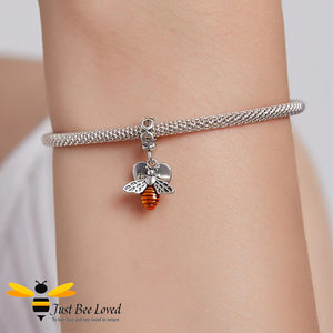 sterling silver hoop charm featuring a honey bee paired with an engraved heart with the text "Live, Laugh, Love". 