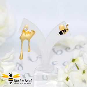 Sterling silver 18kt gold plated asymmetrical earrings featuring honey drips and 3D gold and black honey bee.