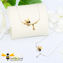 Load image into Gallery viewer, handcrafted sterling silver necklaces featuring a design of an 18kt gold plated and black 3D honey bee resting upon dripping honey. 