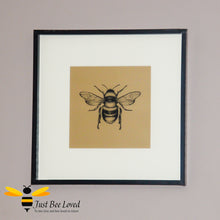 Load image into Gallery viewer, Temerity Jones Framed and mounted black bumblebee on gold backdrop wall art