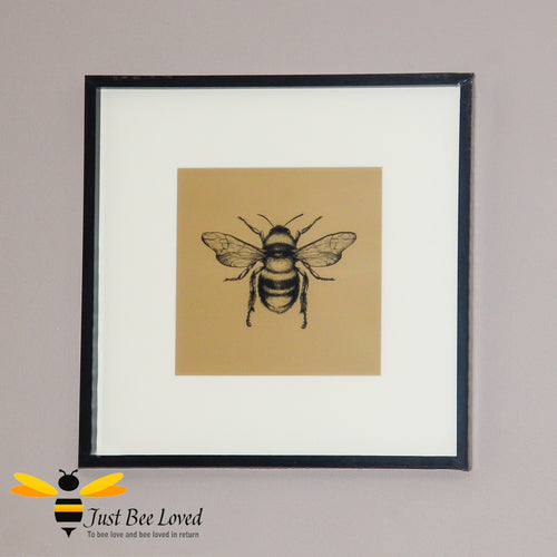 Temerity Jones Framed and mounted black bumblebee on gold backdrop wall art