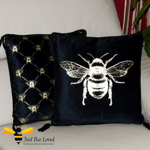 Pair of black velvet plush scatter cushions by Temerity Jones with gold bees design