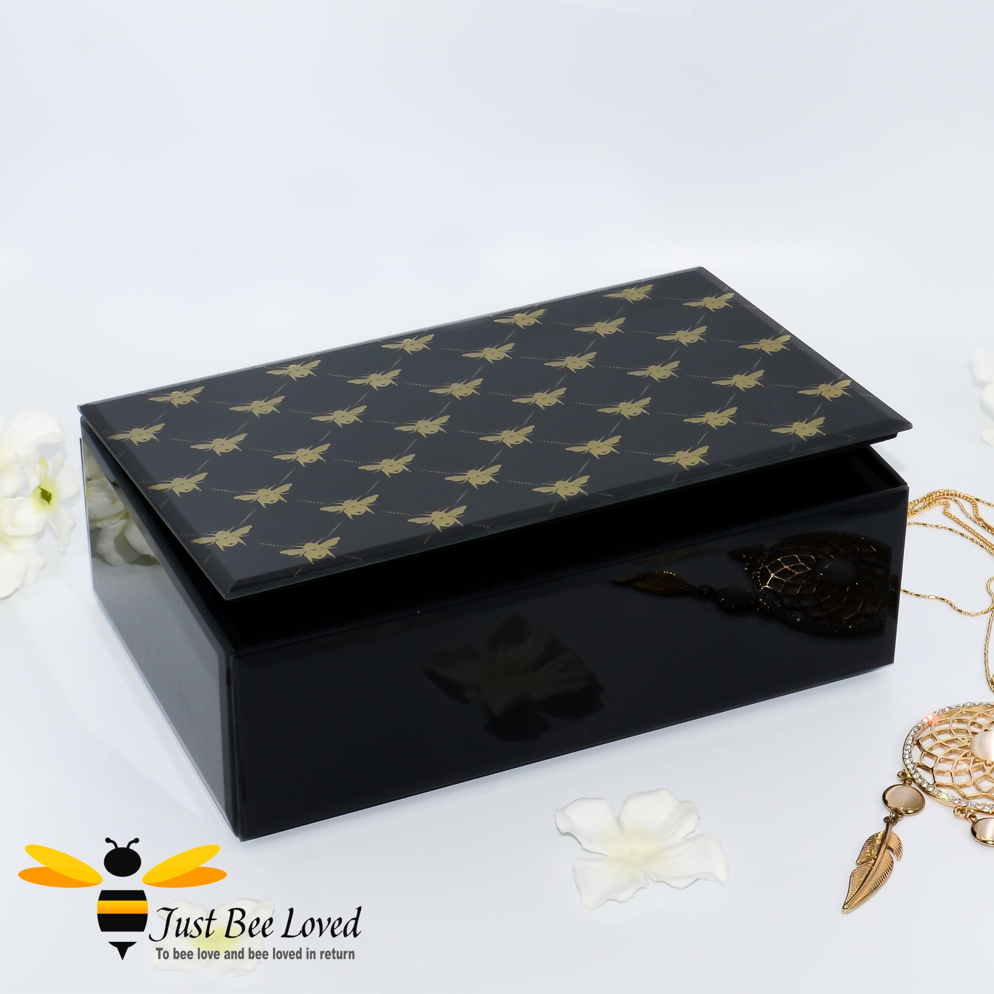 Black glass mirrored jewellery boxes featuring gold bumblebees decoration from Temerity Jones London Bees collection
