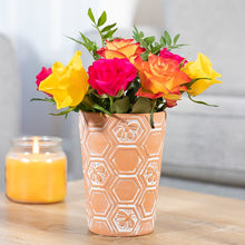 Load image into Gallery viewer, Large terracotta plant pot featuring all over embossed bees and honeycomb design.