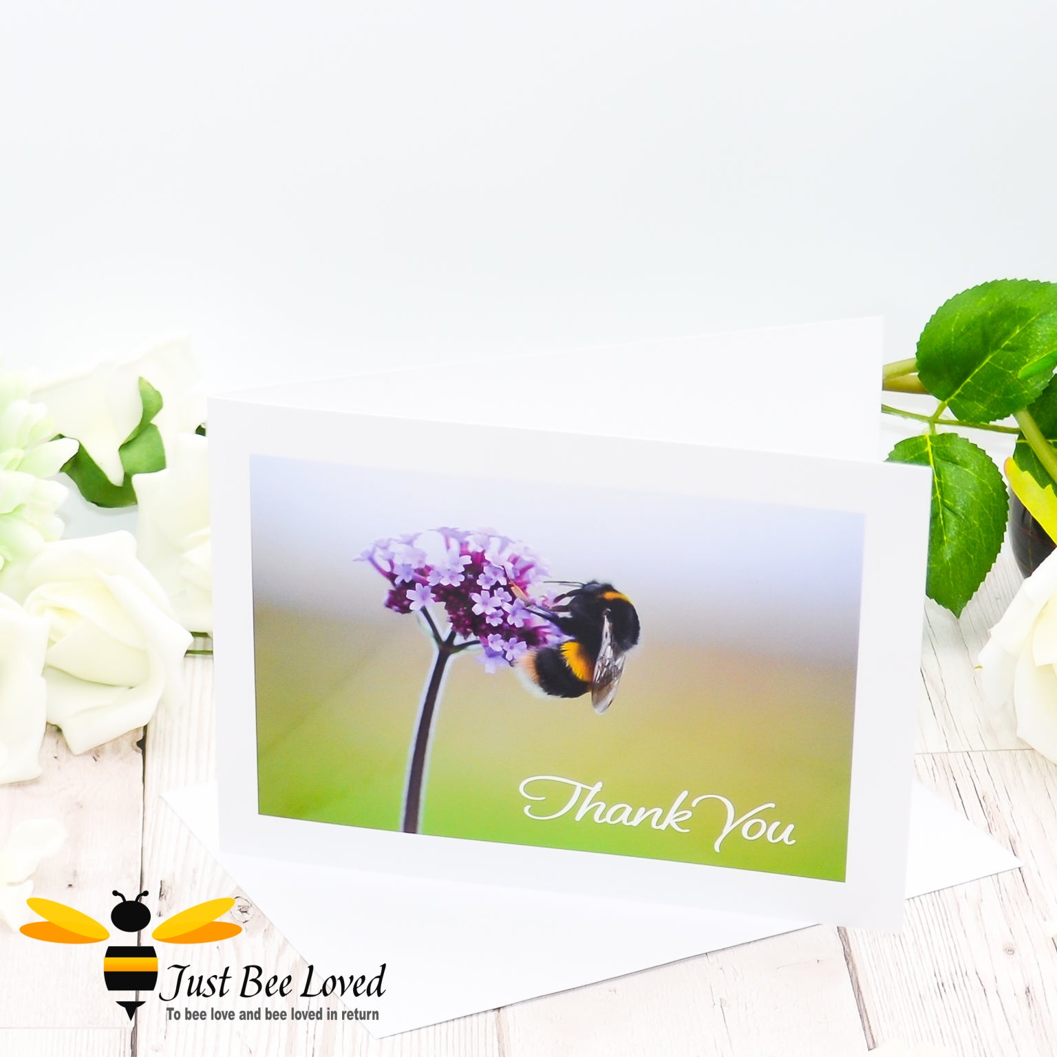 A photographic greeting card featuring a portrait of a bumblebee on a purpletop verbena plant, with 'Thank You' text.