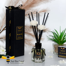 Load image into Gallery viewer, Luxury hexagon shaped rattan reed diffuser with long black reeds mixed with flower headed reeds. Fragrance Blue Spirit Mist