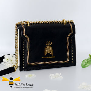 Vegan leather black handbag with large gold bee embellishment