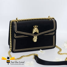Load image into Gallery viewer, Black vegan leather evening handbag with embroidery edged stitching and large gold bee embellishment