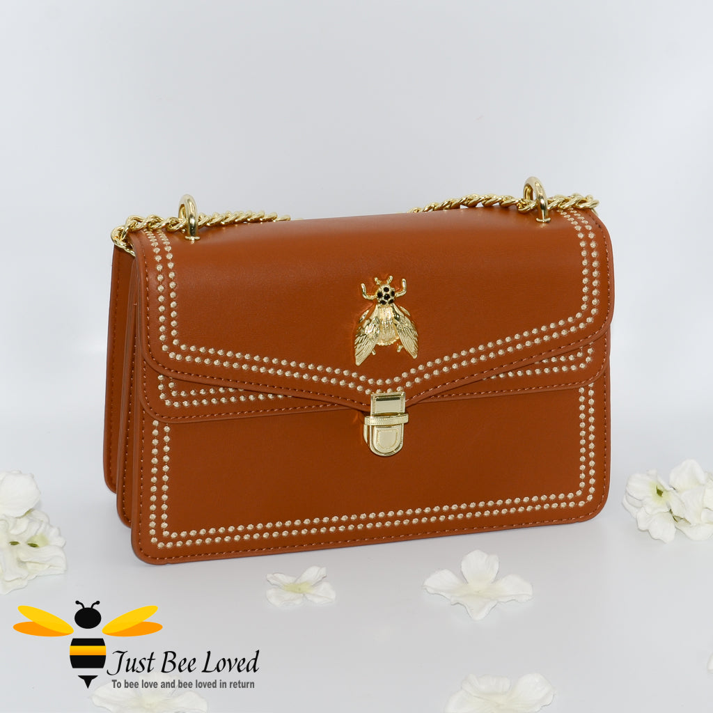 Orange pu leather handbag with embroidery edged stitching and gold bee embellishment