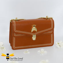 Load image into Gallery viewer, Orange vegan leather evening handbag with embroidery edged stitching and large gold bee embellishment
